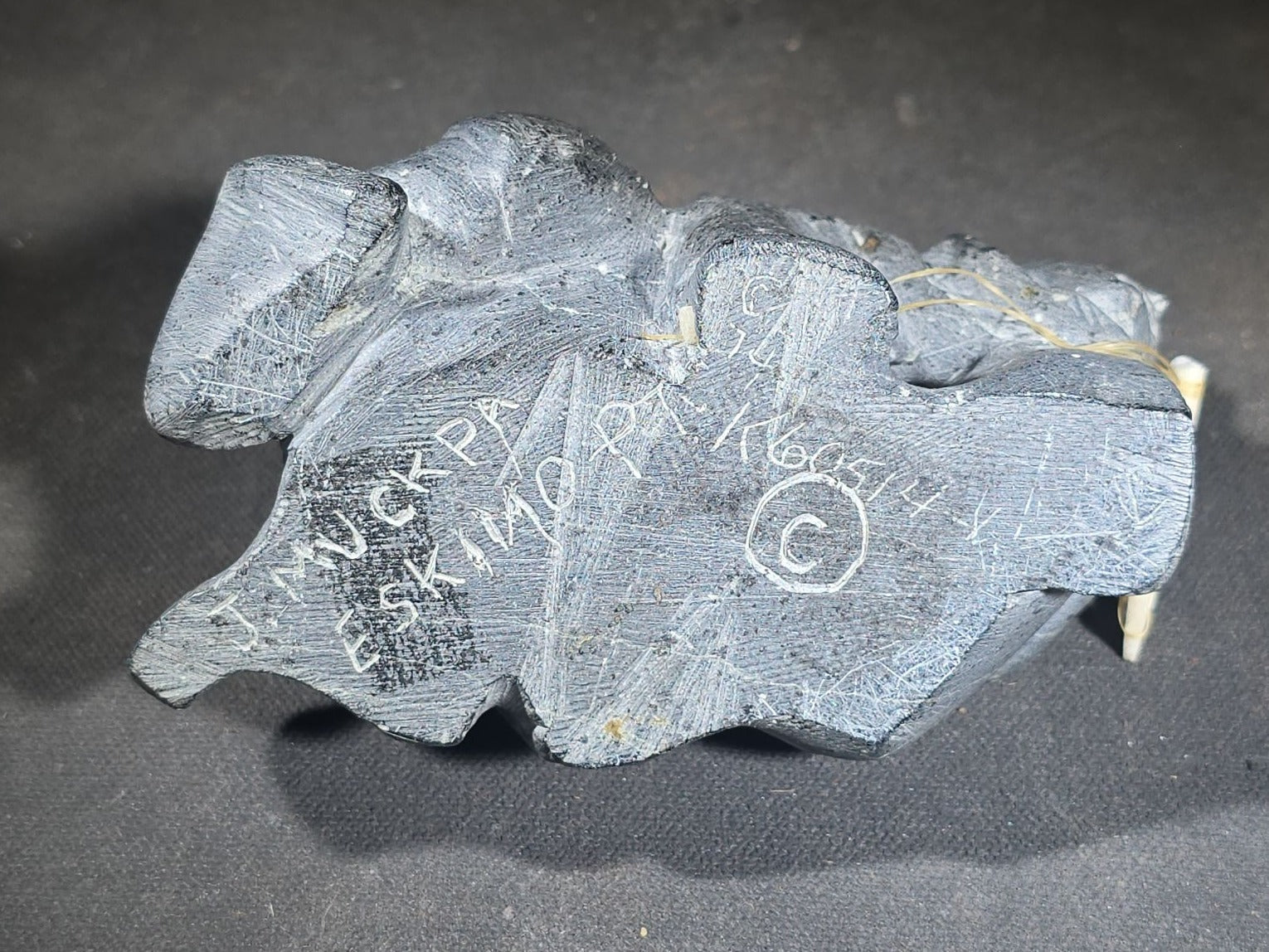Vintage Inuit Soapstone Carving of a Prone Hunter with Bone Spear, Signed J. Muckpa, Note Spear Broken