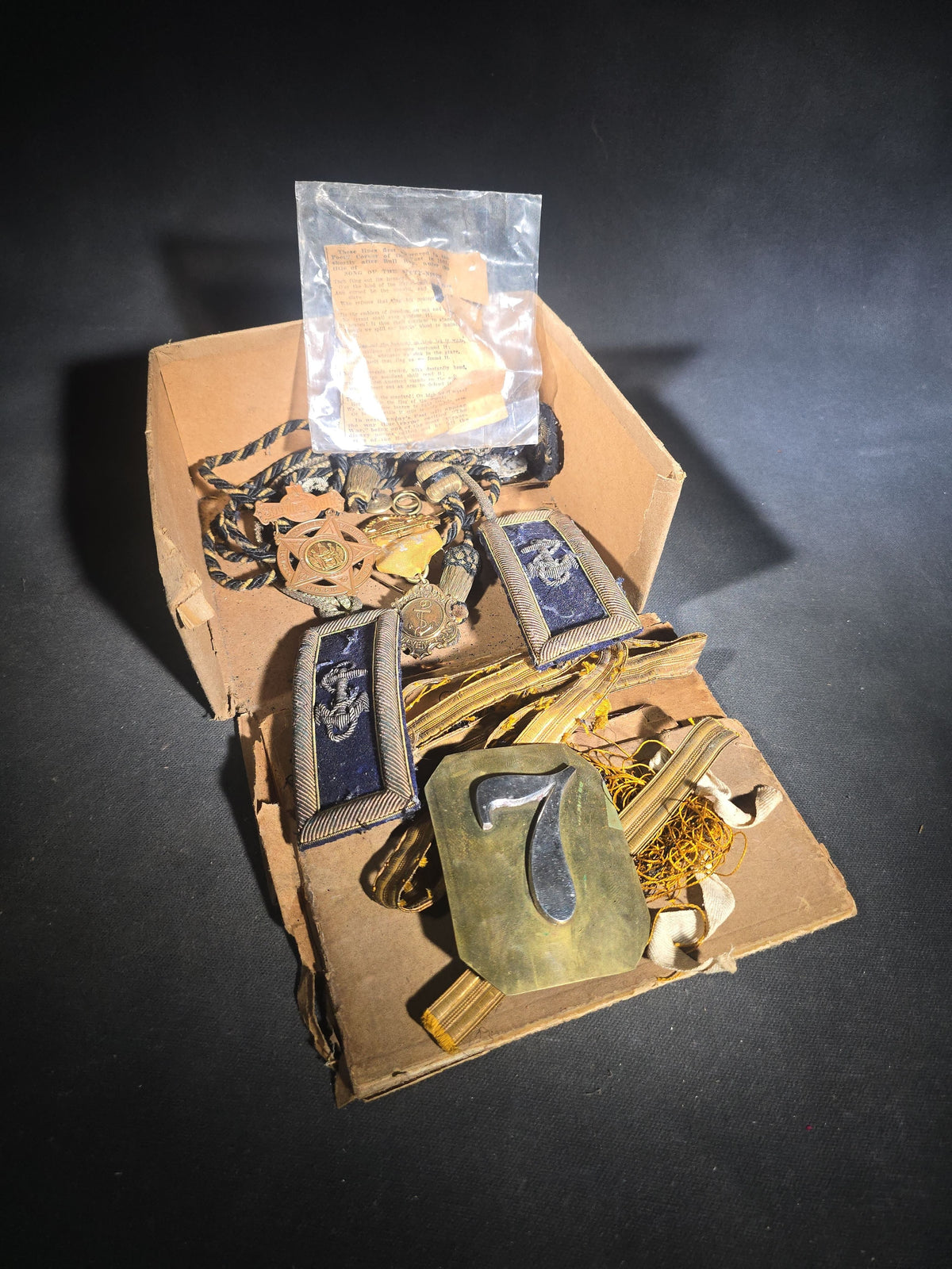 Grouping of Antique U.S. Navy Officer Uniform Remnants and Veteran Organization Medals Including Shoulder Boards, Scoville Buttons, G.A.R. 32nd National Encampment 1898 Souvenir Badge, and Naval Veterans Boston 1904 Convention Medal