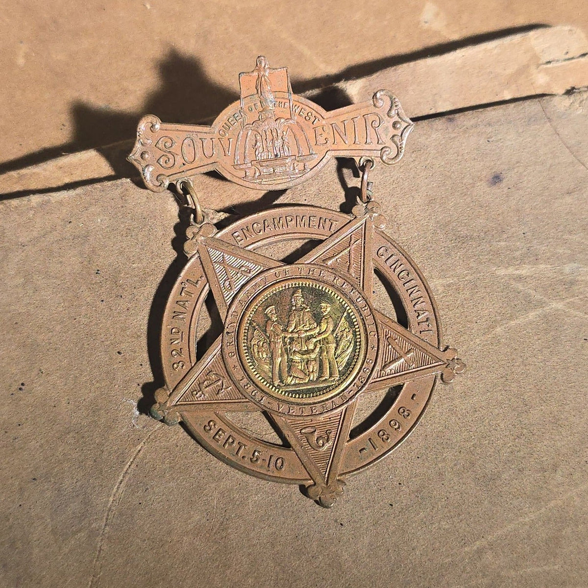 Grouping of Antique U.S. Navy Officer Uniform Remnants and Veteran Organization Medals Including Shoulder Boards, Scoville Buttons, G.A.R. 32nd National Encampment 1898 Souvenir Badge, and Naval Veterans Boston 1904 Convention Medal