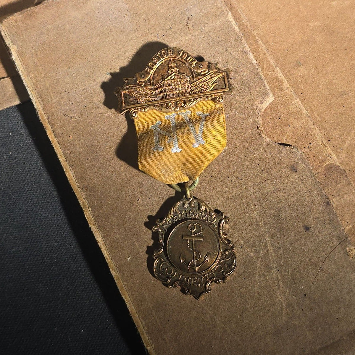 Grouping of Antique U.S. Navy Officer Uniform Remnants and Veteran Organization Medals Including Shoulder Boards, Scoville Buttons, G.A.R. 32nd National Encampment 1898 Souvenir Badge, and Naval Veterans Boston 1904 Convention Medal