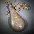 Lot 050 - Antique N.P. Ames "Peace" Pattern Brass Powder Flask with Eagle, Clasped Hands, Stars, and "US" Shield with Military Trophy, Dated 1838, Springfield, Massachusetts, with Braided Cord Carry Strap, 8-1/2" H