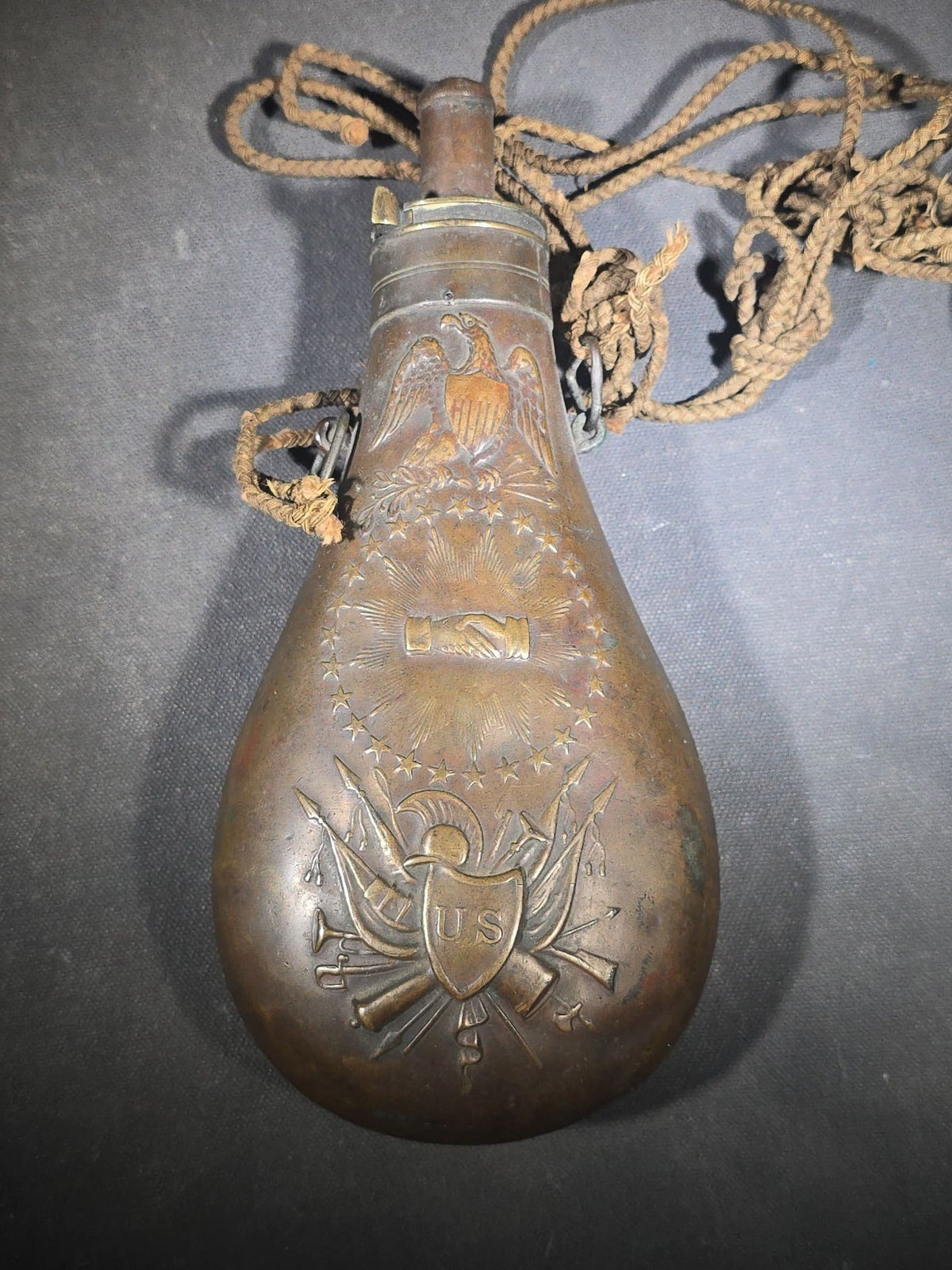 Antique N.P. Ames "Peace" Pattern Brass Powder Flask with Eagle, Clasped Hands, Stars, and "US" Shield with Military Trophy, Dated 1838, Springfield, Massachusetts, with Braided Cord Carry Strap