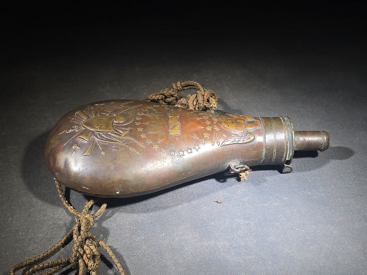 Antique N.P. Ames "Peace" Pattern Brass Powder Flask with Eagle, Clasped Hands, Stars, and "US" Shield with Military Trophy, Dated 1838, Springfield, Massachusetts, with Braided Cord Carry Strap