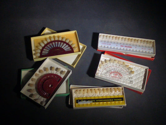 Grouping of Five Vintage Dental Tooth Shade Guide Sets including Anatoform Preceptor, Anatoform VF Porcelaine, New Trilucens, and Steele's Plastic Interchangeable Facings