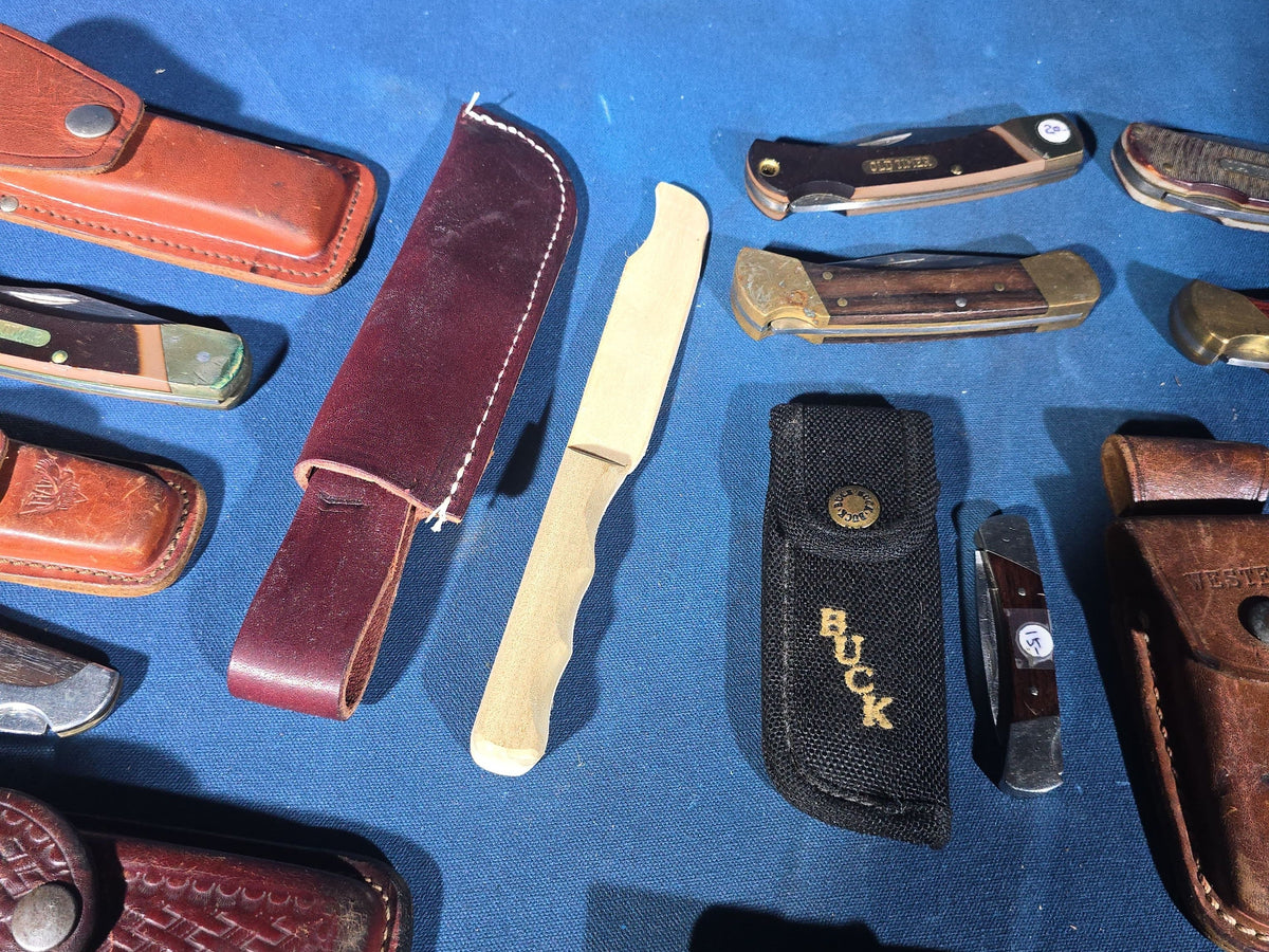 Grouping of 14 Vintage Folding and Pocket Knives with Sheaths including Buck, Schrade Old Timer, Western, Gerber, Case, and Opinel