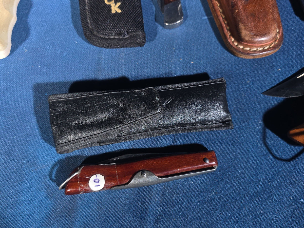 Grouping of 14 Vintage Folding and Pocket Knives with Sheaths including Buck, Schrade Old Timer, Western, Gerber, Case, and Opinel