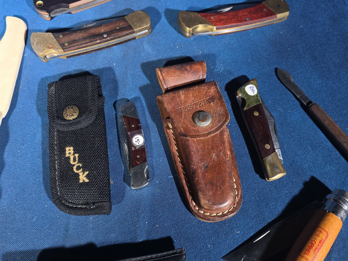 Grouping of 14 Vintage Folding and Pocket Knives with Sheaths including Buck, Schrade Old Timer, Western, Gerber, Case, and Opinel