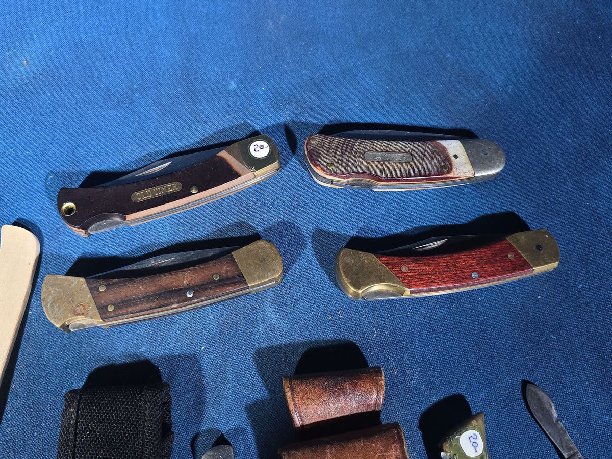 Grouping of 14 Vintage Folding and Pocket Knives with Sheaths including Buck, Schrade Old Timer, Western, Gerber, Case, and Opinel