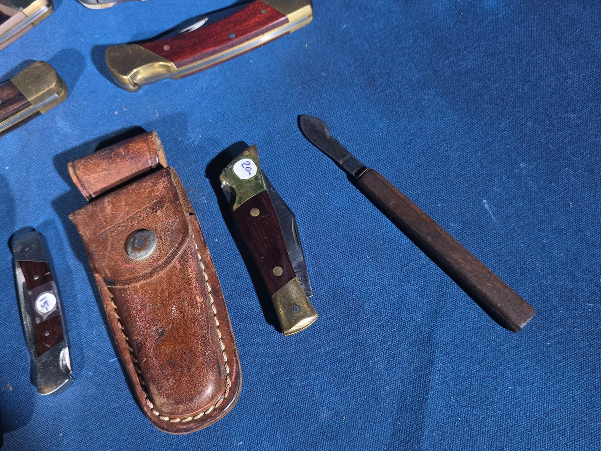 Grouping of 14 Vintage Folding and Pocket Knives with Sheaths including Buck, Schrade Old Timer, Western, Gerber, Case, and Opinel