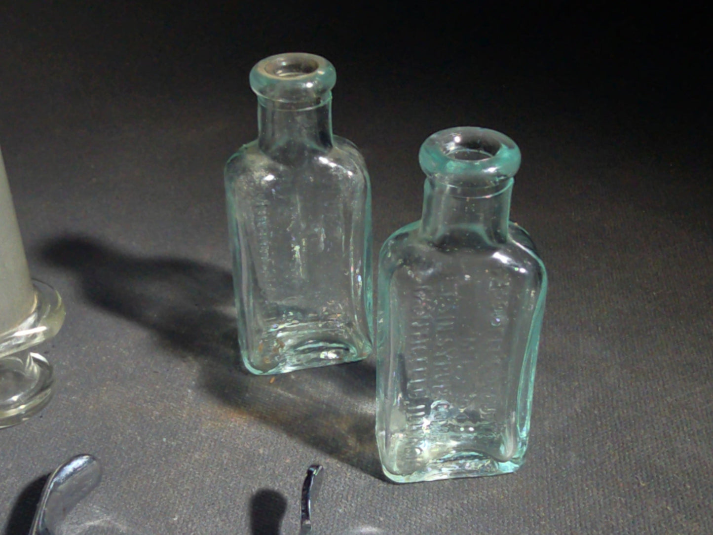 Grouping of Vintage Dental and Medical Pieces including Eli Lilly Merthiolate Twin Refill Box, Glass Syringe, and Chrome Dental Aspirating Syringe