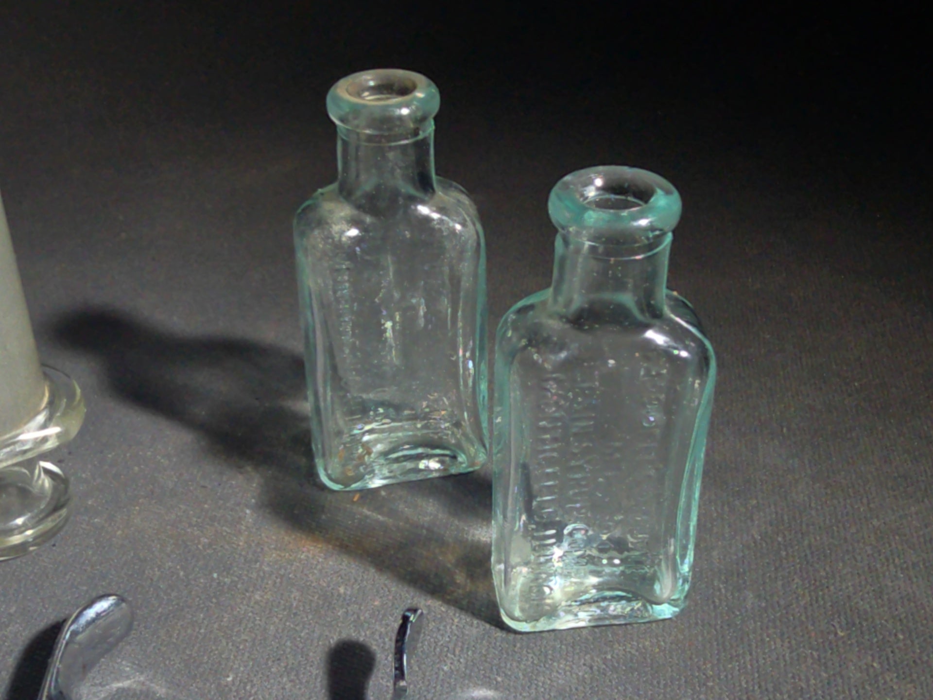 Grouping of Vintage Dental and Medical Pieces including Eli Lilly Merthiolate Twin Refill Box, Glass Syringe, and Chrome Dental Aspirating Syringe