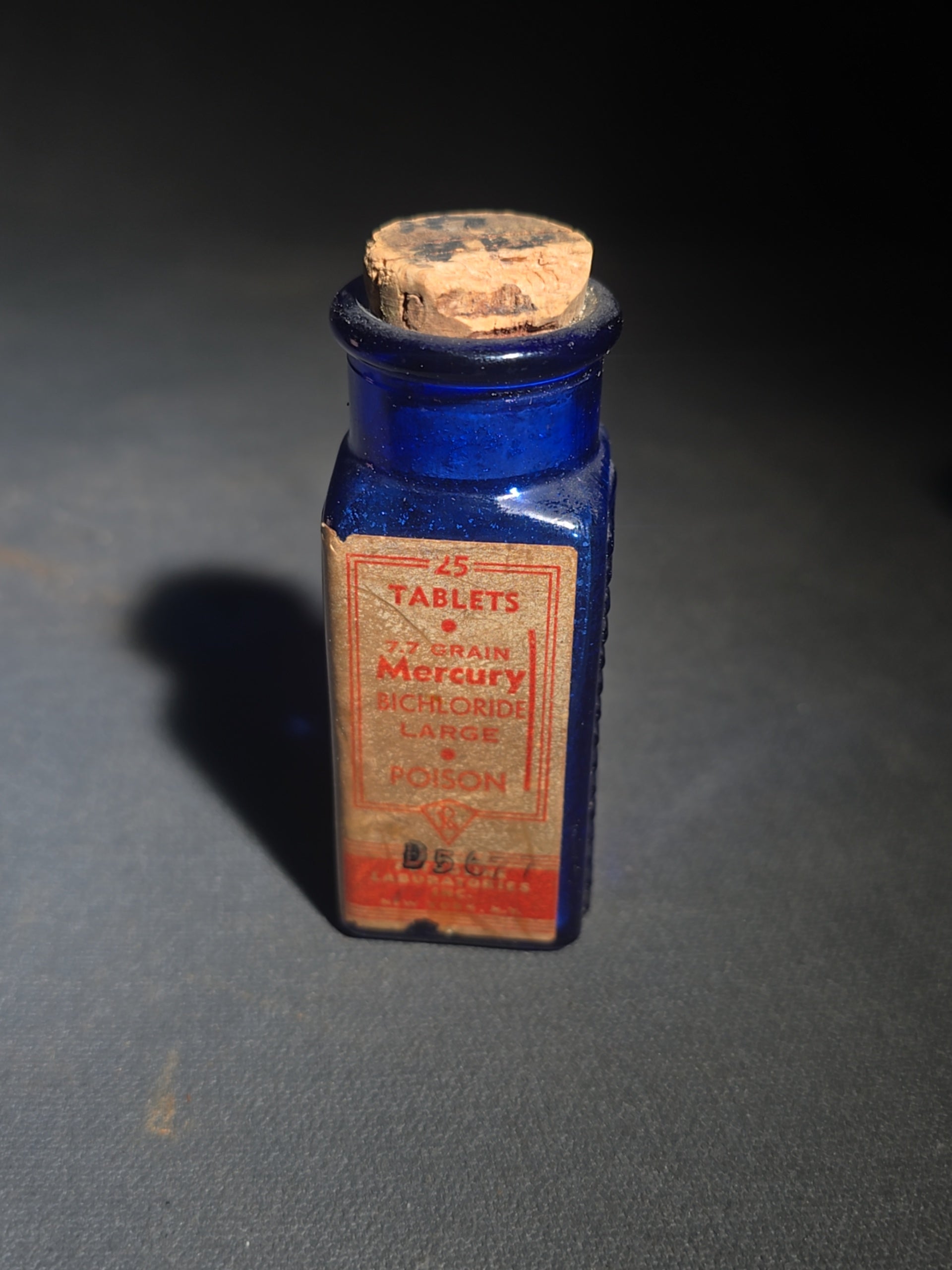 Grouping of Seven Antique and Vintage Apothecary Smalls including Belladona Leaves and Iodine Tincture Poison Bottles, Bichloride Mercury Poison Bottle, Cobalt Blue Eye Cup, and Sheaffer Skrip Ink Bottle
