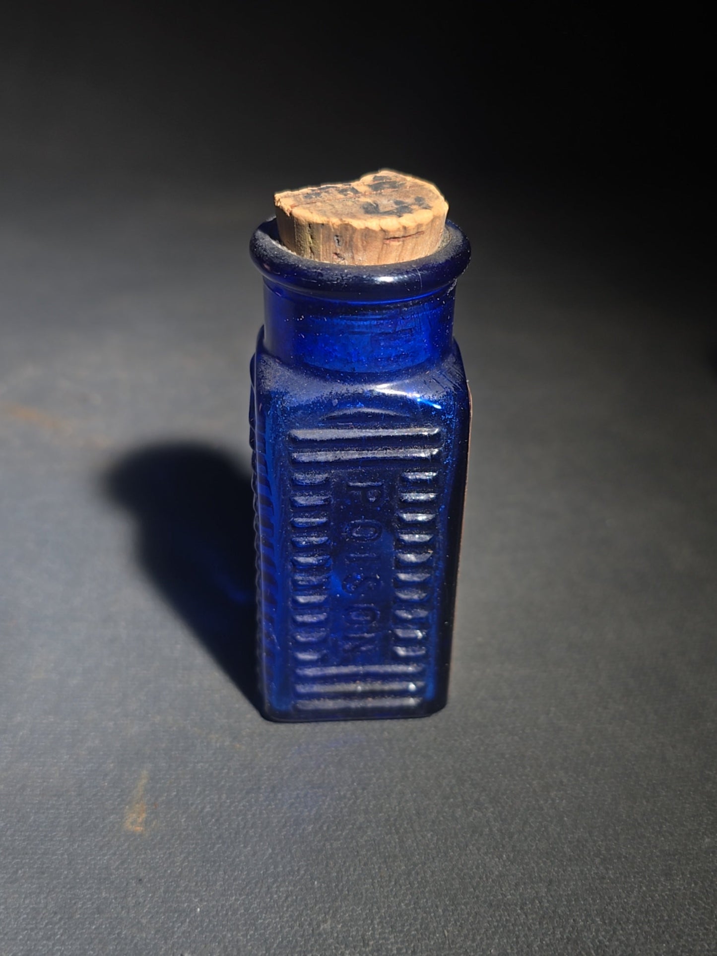 Grouping of Seven Antique and Vintage Apothecary Smalls including Belladona Leaves and Iodine Tincture Poison Bottles, Bichloride Mercury Poison Bottle, Cobalt Blue Eye Cup, and Sheaffer Skrip Ink Bottle