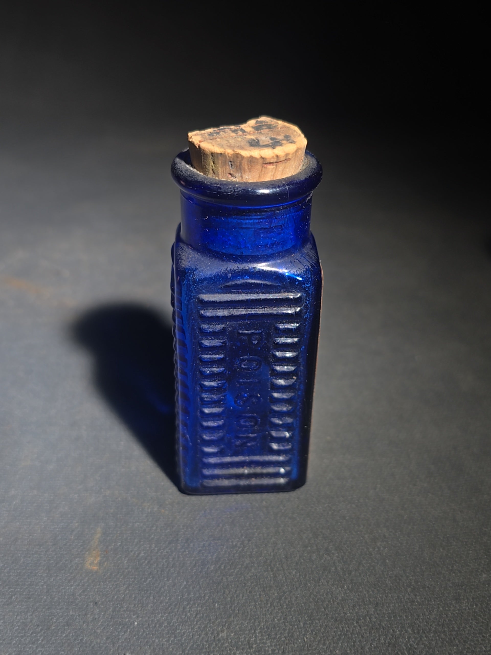Grouping of Seven Antique and Vintage Apothecary Smalls including Belladona Leaves and Iodine Tincture Poison Bottles, Bichloride Mercury Poison Bottle, Cobalt Blue Eye Cup, and Sheaffer Skrip Ink Bottle