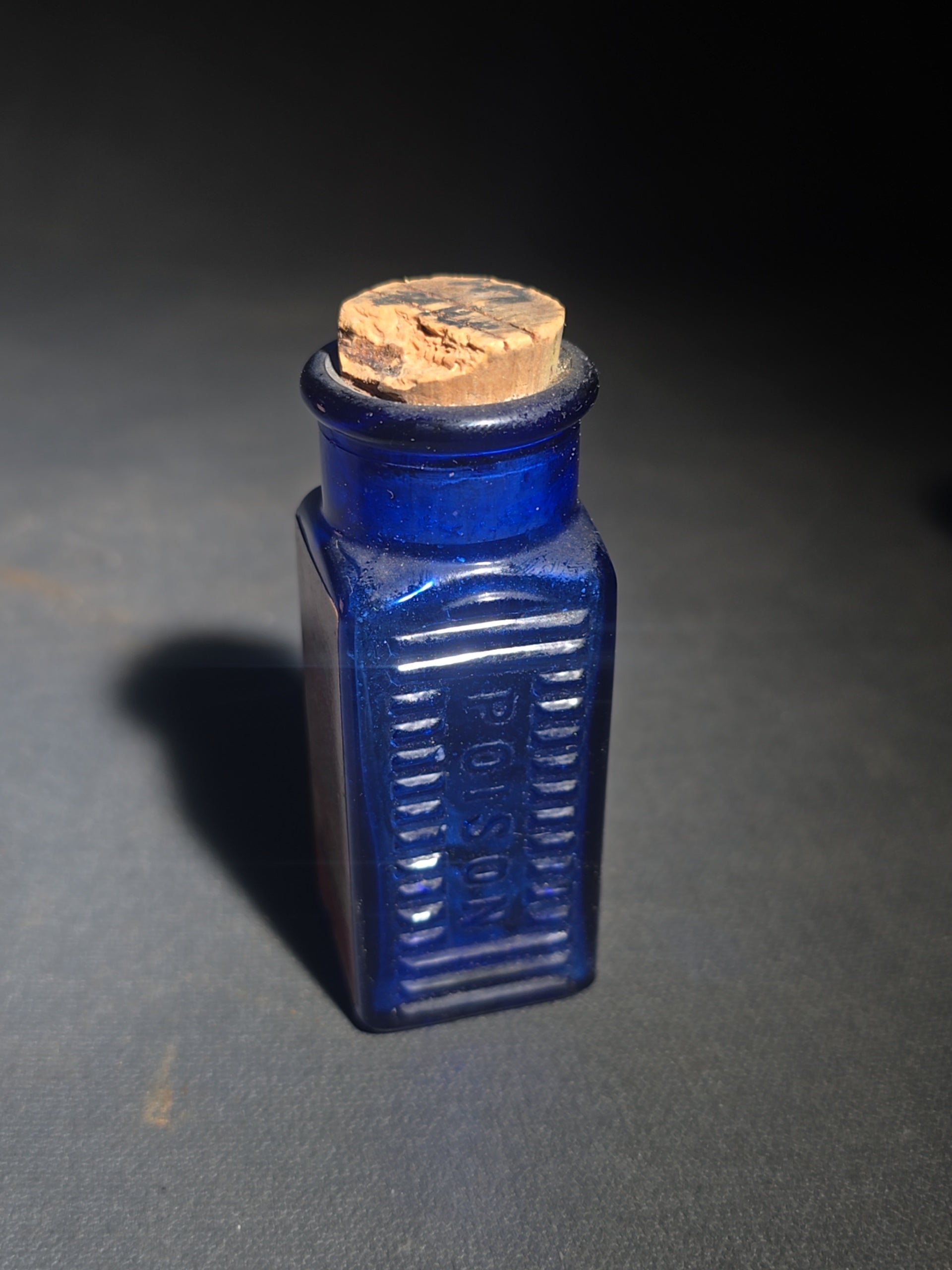 Grouping of Seven Antique and Vintage Apothecary Smalls including Belladona Leaves and Iodine Tincture Poison Bottles, Bichloride Mercury Poison Bottle, Cobalt Blue Eye Cup, and Sheaffer Skrip Ink Bottle