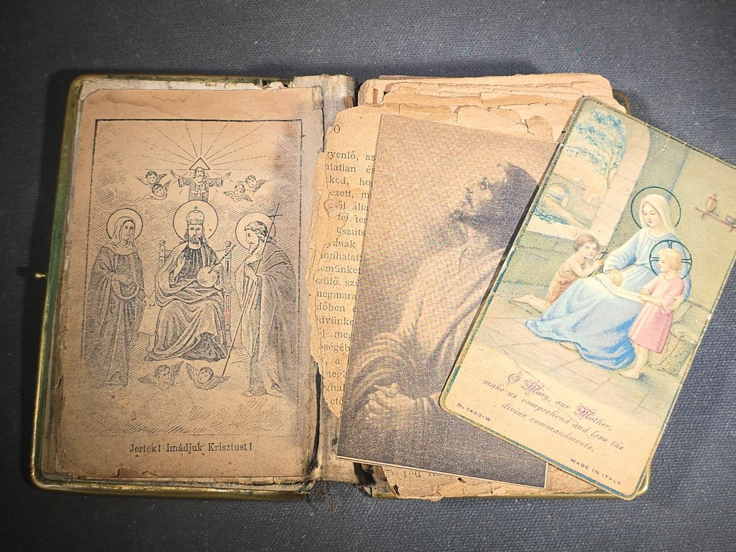 Antique Hungarian-Language Catholic Prayer Book with Metal and Bone-Decorated Covers, Cross, and Religious Medallions, with Loose Holy Cards, Poor Condition