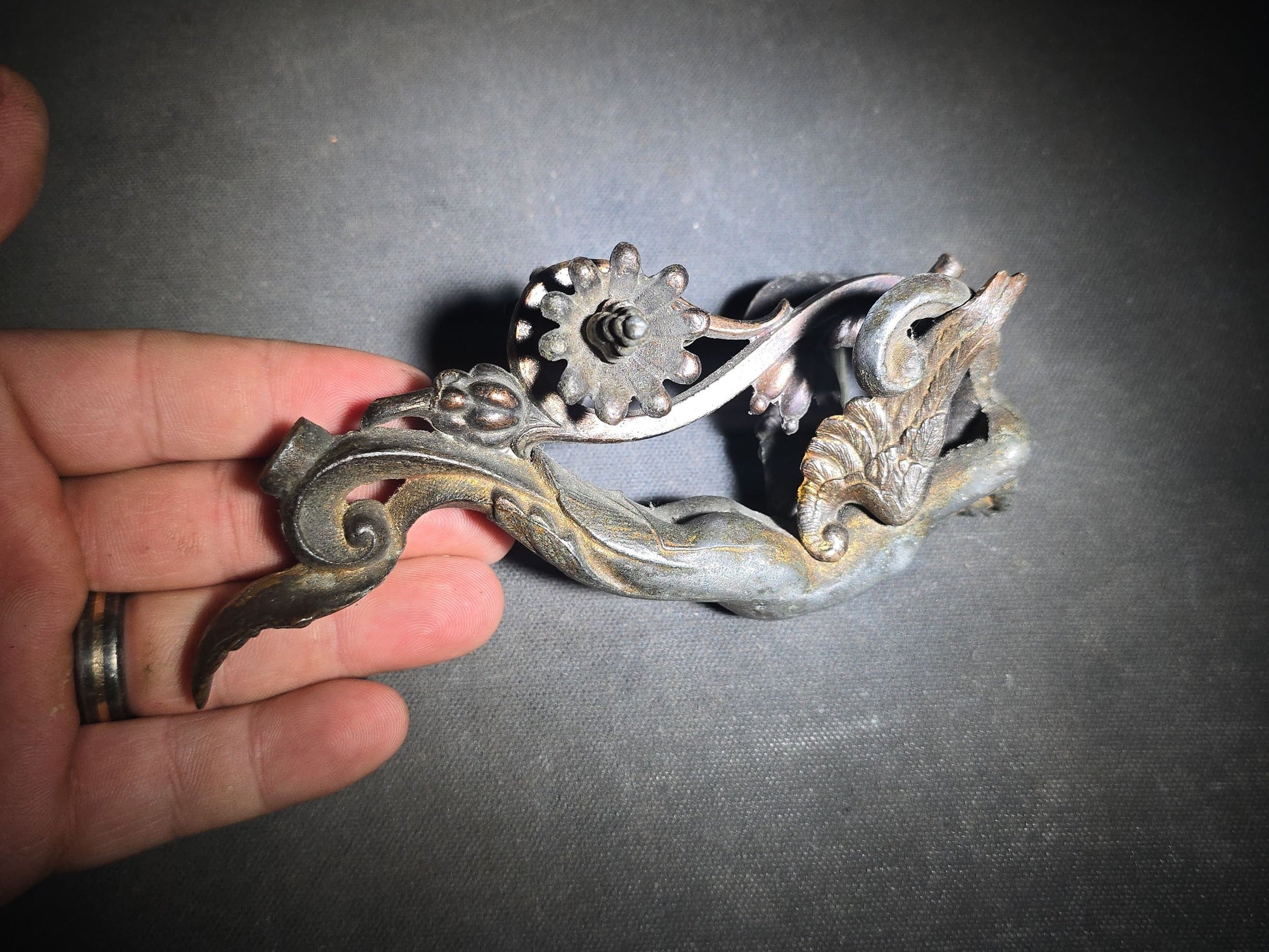 Antique Cast Metal Figural Ornament Fragment with Winged Cherub, Scrollwork, and Floral Rosette