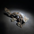 Lot 106 - Antique Cast Metal Figural Ornament Fragment with Winged Cherub, Scrollwork, and Floral Rosette