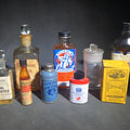 Lot 154 - Grouping of 12 Antique and Vintage Pharmaceutical Bottles and Tins Including Samson's Liniment, M.A. Thedford's Black Draught Liver Medicine, Dr. I.W. Lyon's Tooth Powder, and Johnson & Johnson Dental Floss