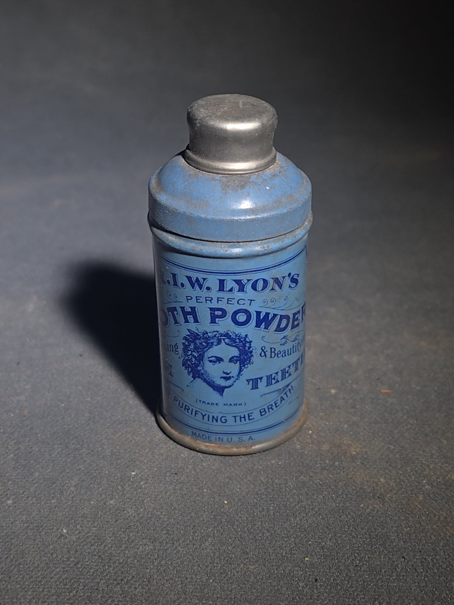 Grouping of 12 Antique and Vintage Pharmaceutical Bottles and Tins including Samson's Liniment, M.A. Thedford's Black Draught Liver Medicine, Dr. I.W. Lyon's Tooth Powder, and Johnson & Johnson Dental Floss