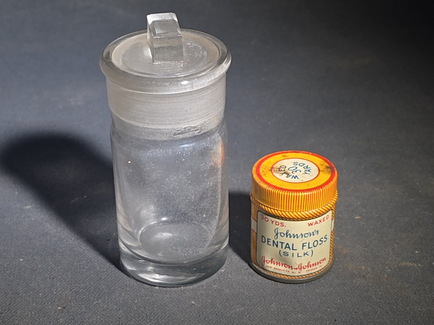 Grouping of 12 Antique and Vintage Pharmaceutical Bottles and Tins including Samson's Liniment, M.A. Thedford's Black Draught Liver Medicine, Dr. I.W. Lyon's Tooth Powder, and Johnson & Johnson Dental Floss
