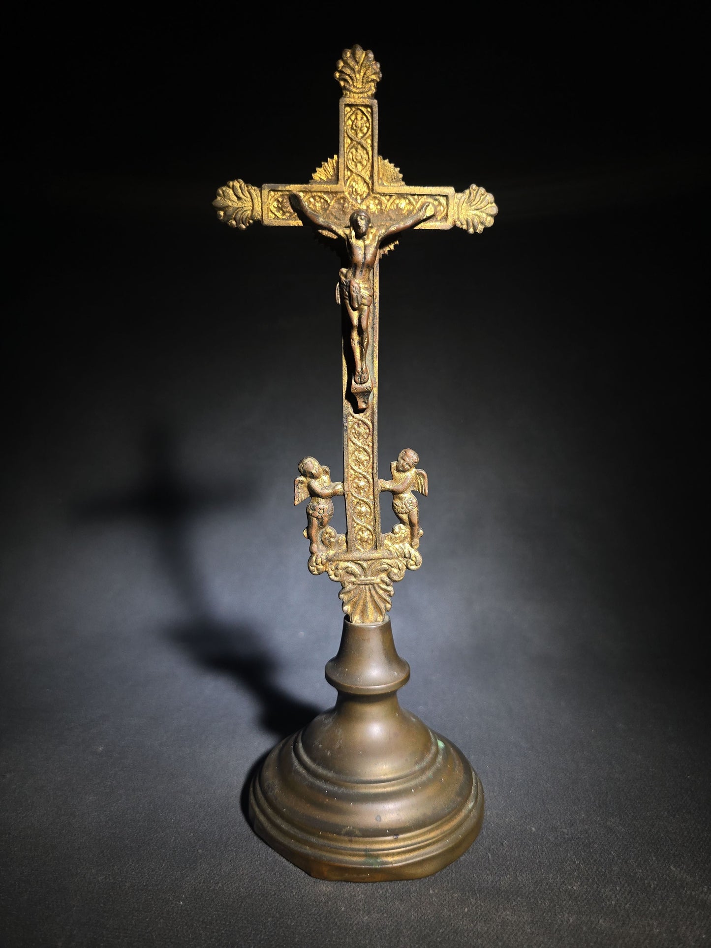 Antique Brass Standing Crucifix with Corpus, Flanking Cherubs, Palmette Terminals, and Shell Motif on Turned Dome Base