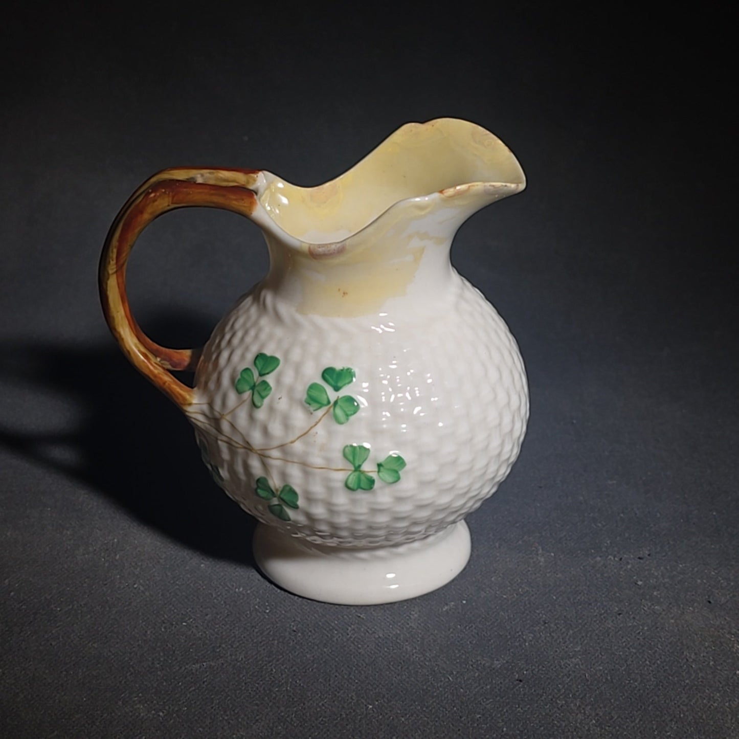 Trio of Vintage Belleek Shamrock Basketweave Pieces including Coffeepot, Creamer, and Open Sugar Bowl, Co. Fermanagh, Ireland, Note Chipping to the Creamer