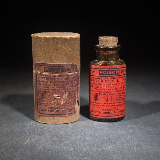 Antique Sharp & Dohme's No. 25 Green Antiseptic Disks Embossed Amber Poison Bottle with Cork, Antidote Label, and Original Cardboard Tube, Baltimore, Maryland