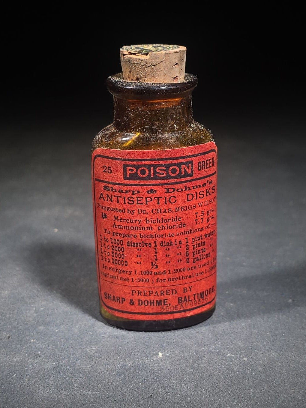 Antique Sharp & Dohme's No. 25 Green Antiseptic Disks Embossed Amber Poison Bottle with Cork, Antidote Label, and Original Cardboard Tube, Baltimore, Maryland