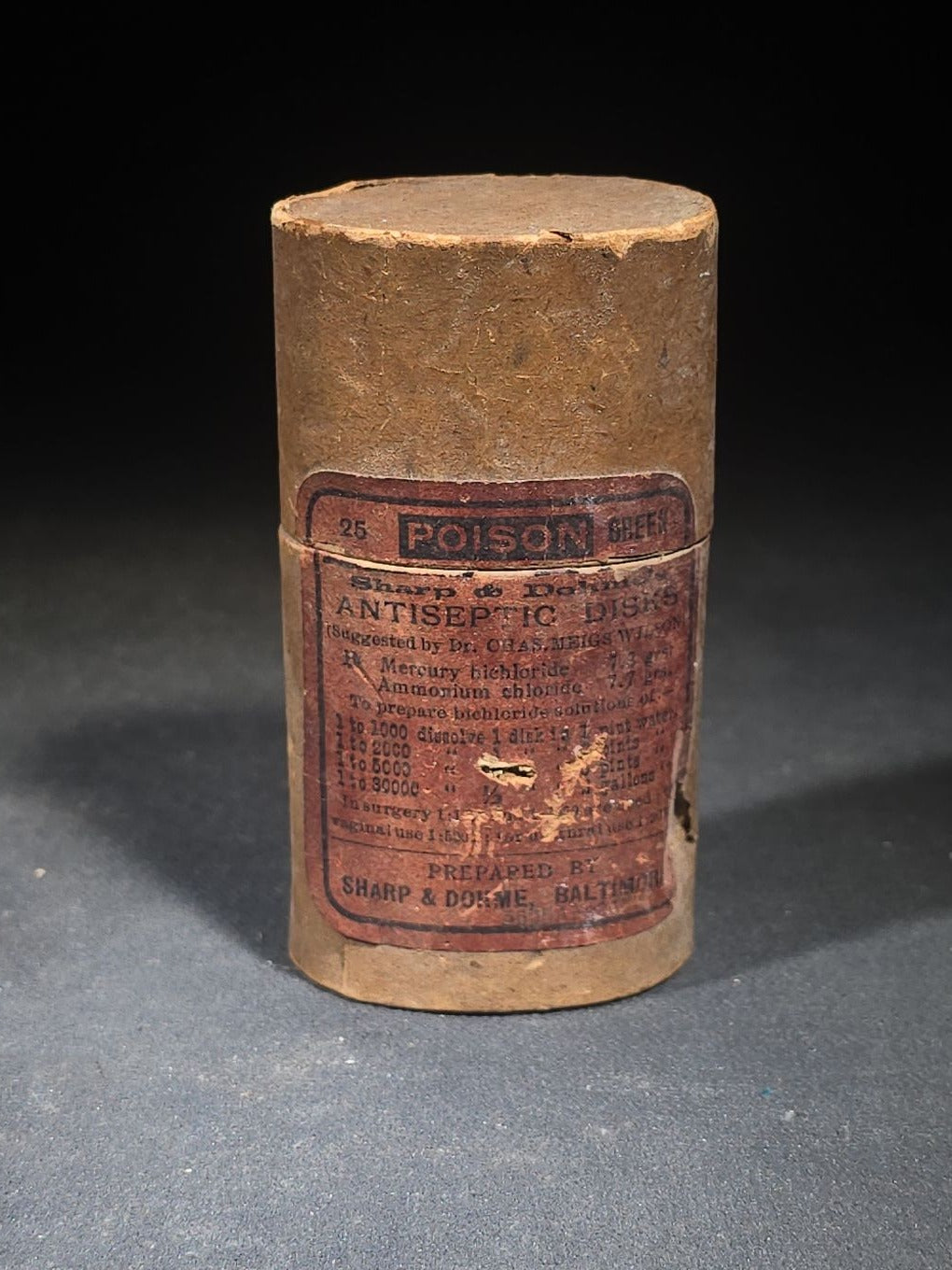 Antique Sharp & Dohme's No. 25 Green Antiseptic Disks Embossed Amber Poison Bottle with Cork, Antidote Label, and Original Cardboard Tube, Baltimore, Maryland