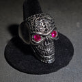 Lot 045 - Modern Stainless Steel Skull Biker Ring with Pink Stone Eyes, Size 10