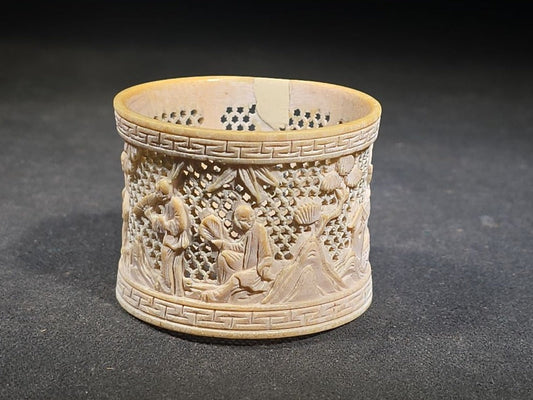 Antique Chinese Carved and Reticulated Bone Napkin Ring with Figures in Landscape and Geometric Borders