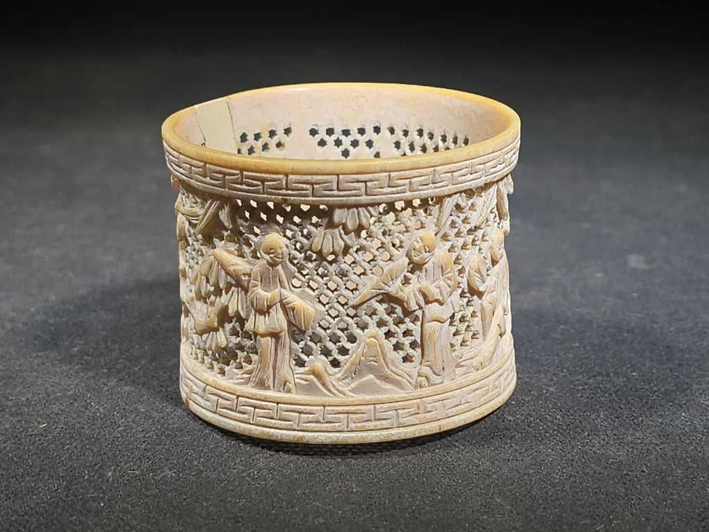 Antique Chinese Carved and Reticulated Bone Napkin Ring with Figures in Landscape and Geometric Borders