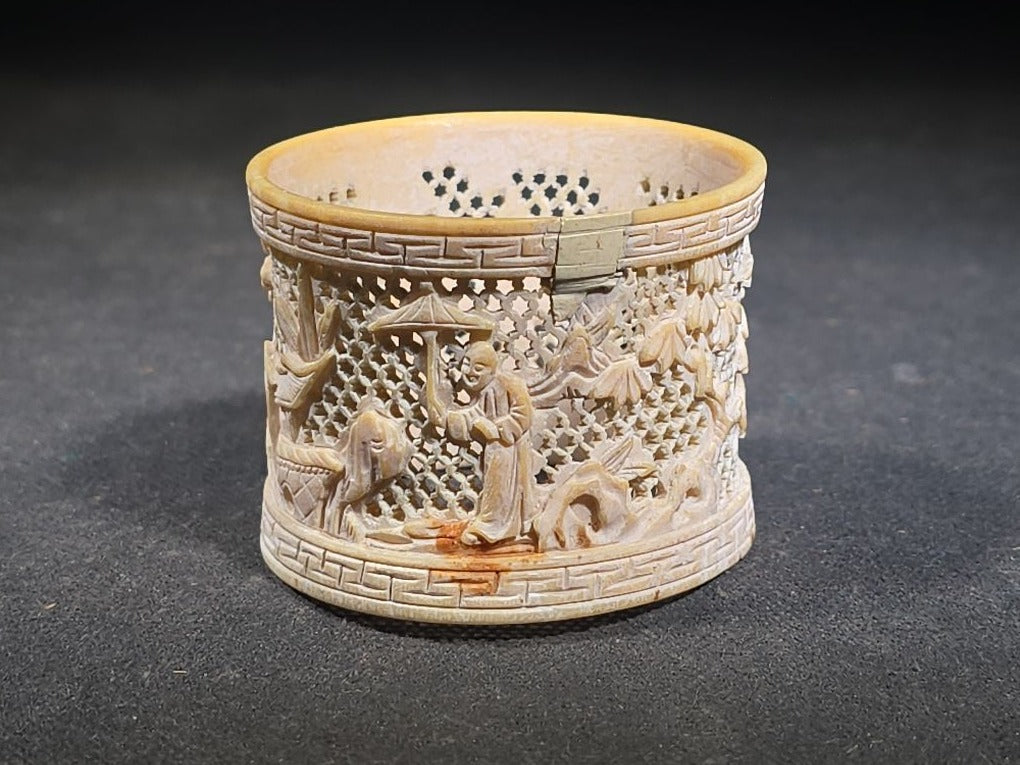 Antique Chinese Carved and Reticulated Bone Napkin Ring with Figures in Landscape and Geometric Borders