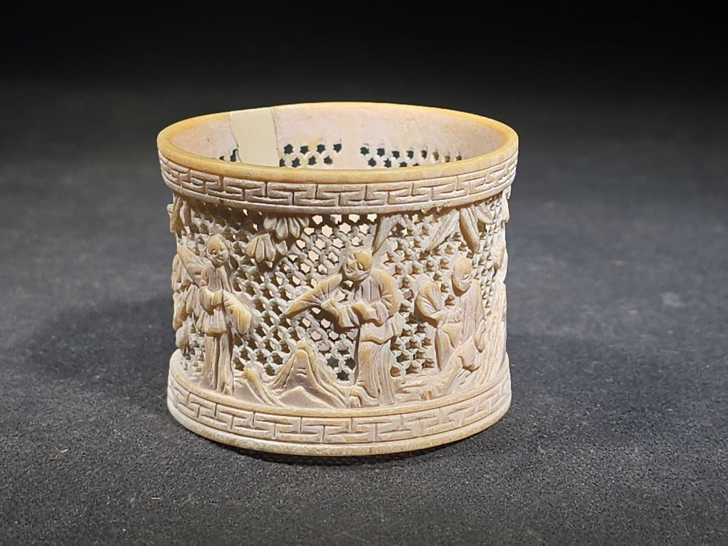Antique Chinese Carved and Reticulated Bone Napkin Ring with Figures in Landscape and Geometric Borders