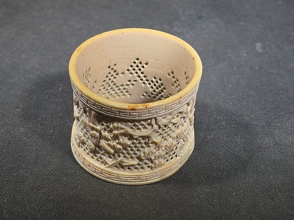 Antique Chinese Carved and Reticulated Bone Napkin Ring with Figures in Landscape and Geometric Borders