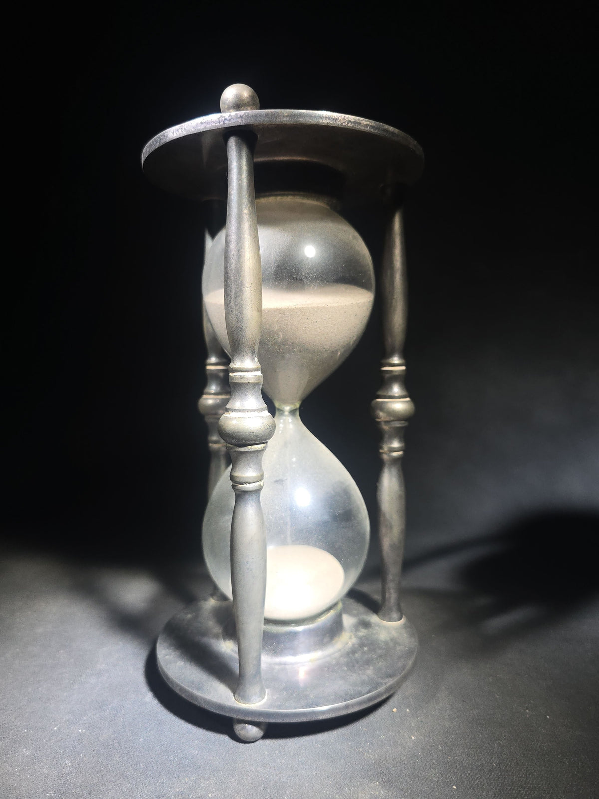 Vintage Pewter-Tone Metal Hourglass Sand Timer with Turned Spindle Columns and Ball Feet