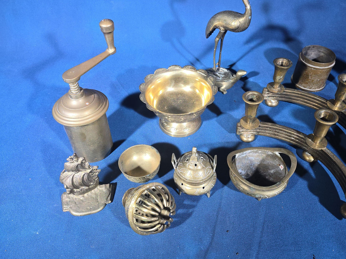 Grouping of Vintage Brass Items including Figural Crane Candlesticks, Candelabra, Pedestal Bowl, Incense Burner, Pepper Grinder, and Ship Bookends