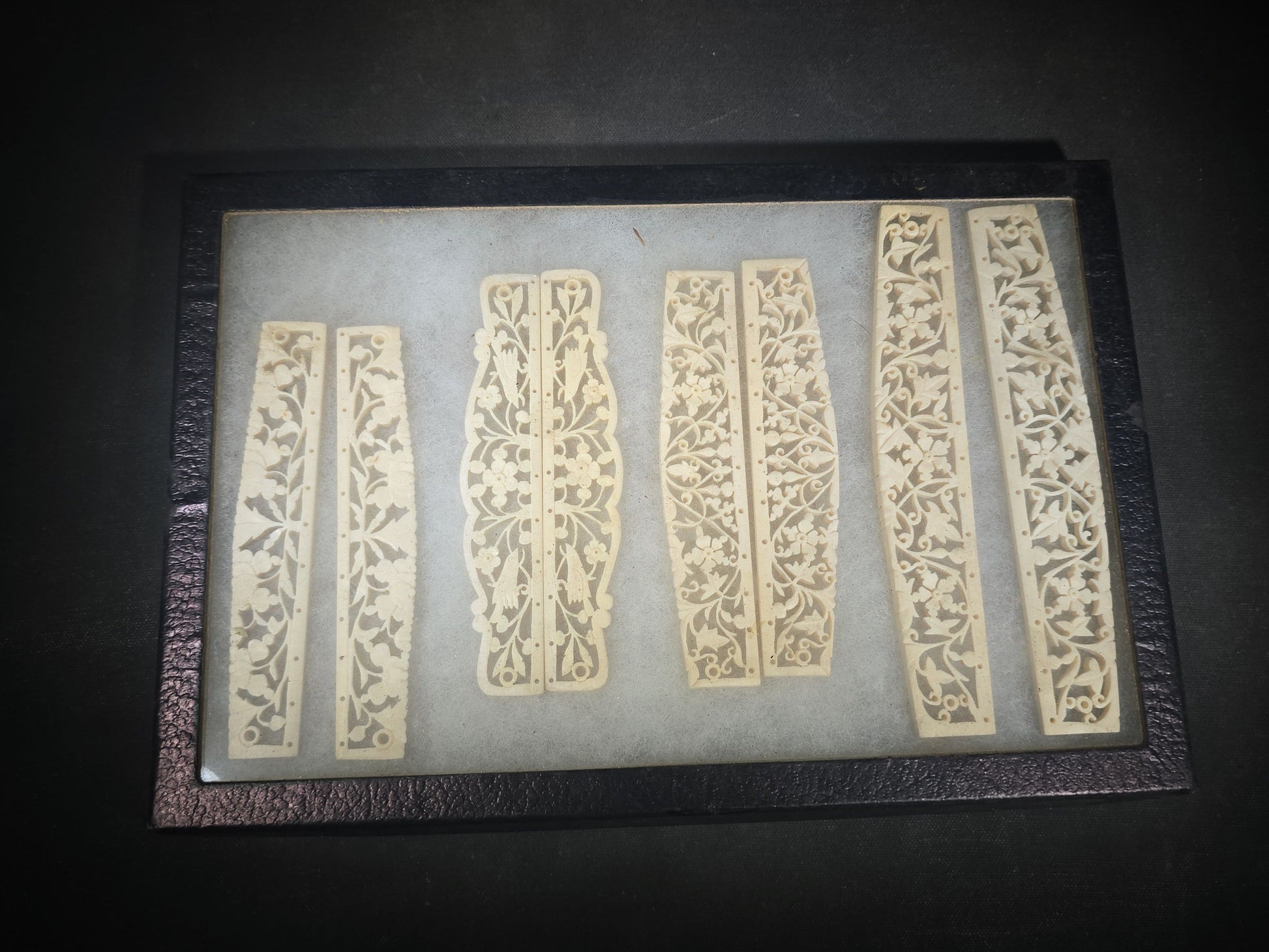 Antique Carved Bone Brisé Fan Staves with Pierced Floral and Vine Designs in Glass-Top Riker Display Case