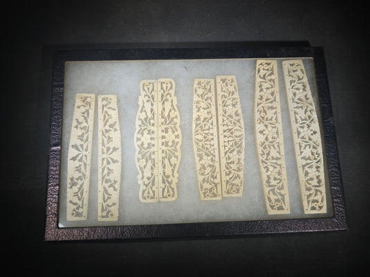 Antique Carved Bone Brisé Fan Staves with Pierced Floral and Vine Designs in Glass-Top Riker Display Case