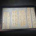 Lot 117 - Antique Carved Bone Brisé Fan Staves with Pierced Floral and Vine Designs in Glass-Top Riker Display Case