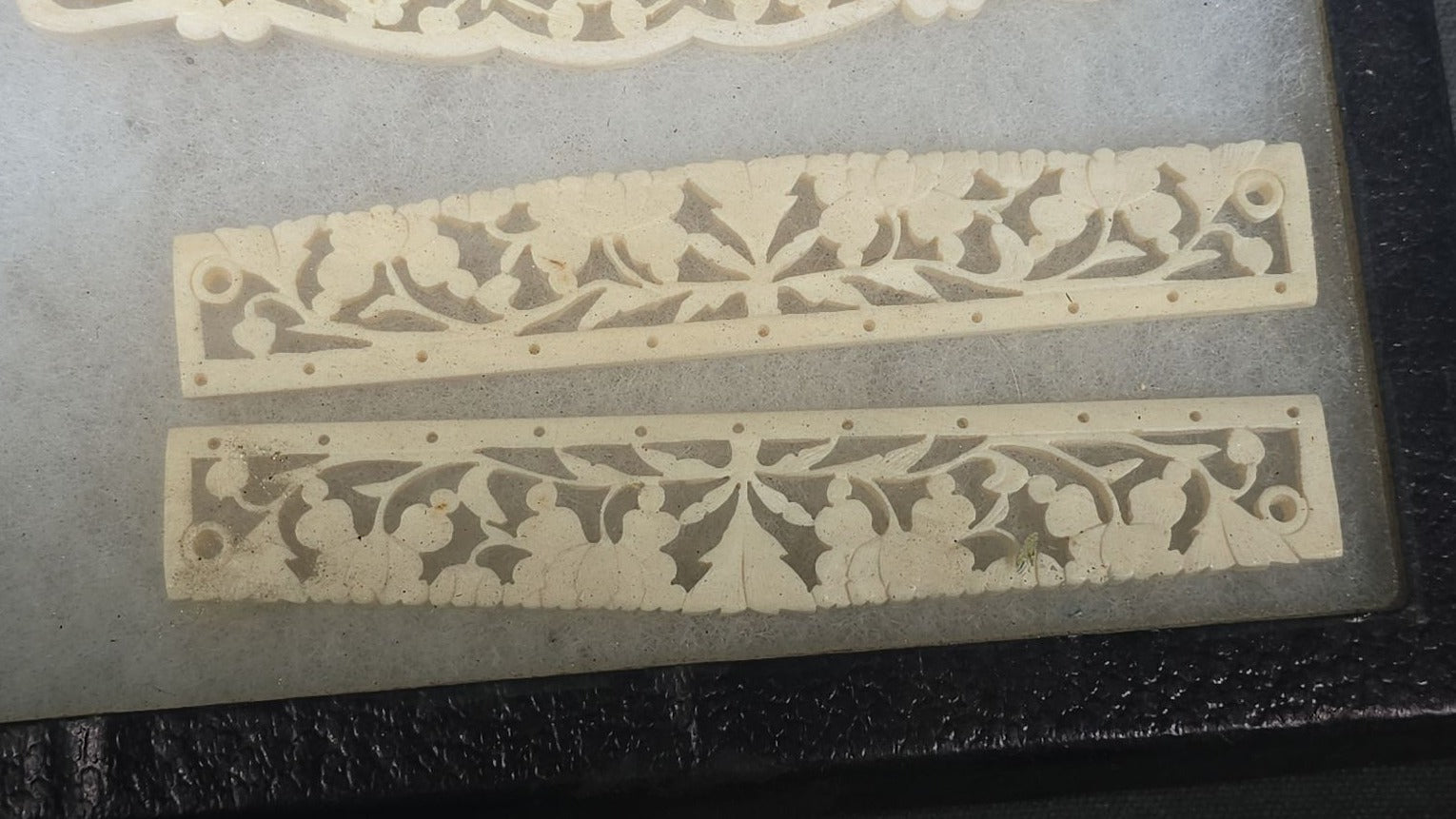 Antique Carved Bone Brisé Fan Staves with Pierced Floral and Vine Designs in Glass-Top Riker Display Case