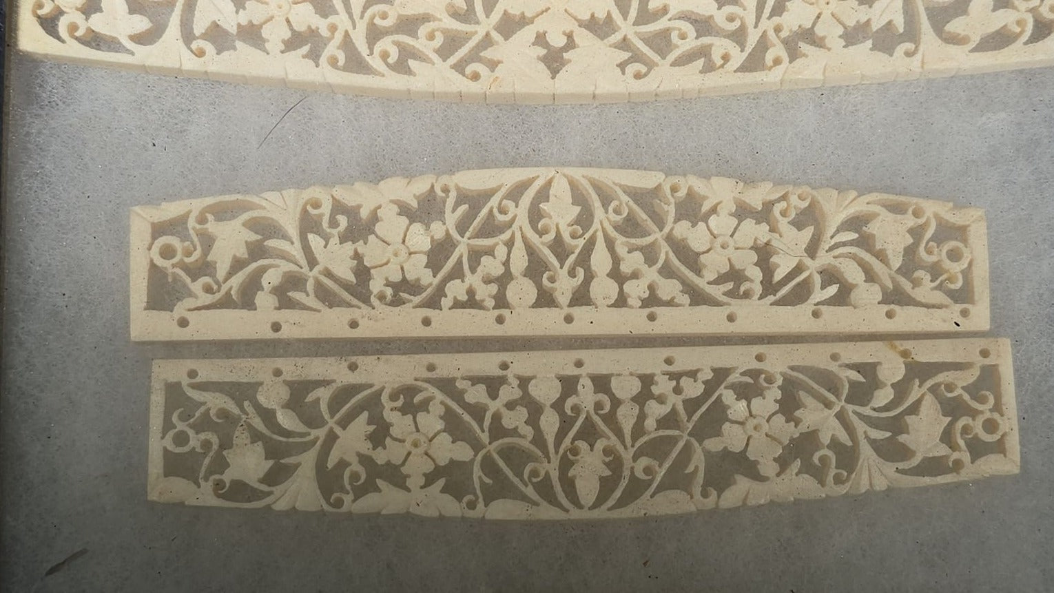 Antique Carved Bone Brisé Fan Staves with Pierced Floral and Vine Designs in Glass-Top Riker Display Case