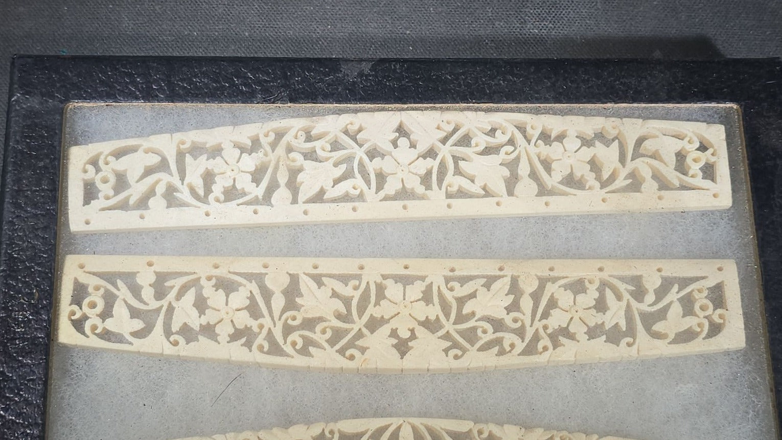 Antique Carved Bone Brisé Fan Staves with Pierced Floral and Vine Designs in Glass-Top Riker Display Case