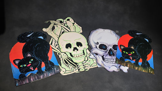 Grouping of Four Vintage Die-Cut Halloween Paper Decorations including Glow-in-the-Dark Jointed Skeleton, Skull, and Two Black Cats