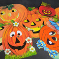Lot 114 - Grouping of Seven Vintage Die-Cut Halloween Jack-O-Lantern and Pumpkin Decorations Including Jointed Pumpkin Scarecrow Figure