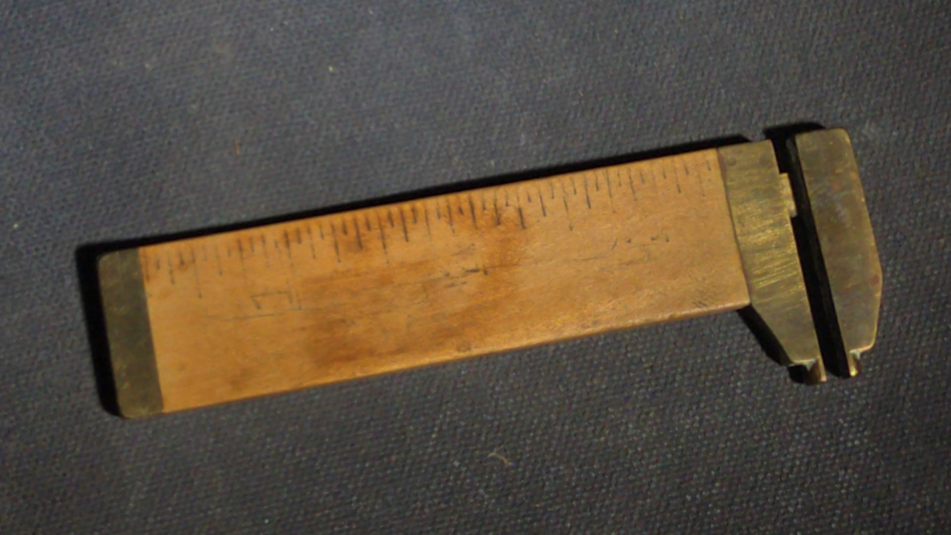 Grouping of Seven Antique and Vintage Smalls including Four Letter Openers, Brass Buckle, Stanley Ruler, and Screw-Top Drill Bit Holder