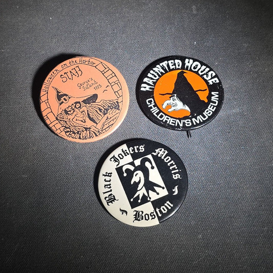 Trio of Vintage Halloween Pinback Buttons including Halloween on the Harbor George's Island 1993 Staff, Haunted House Children's Museum, and Black Jokers Morris Boston