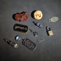 Lot 156 - Grouping of Vintage and Modern Smalls Including Carved Wood Figure, Carved Netsuke-Style Figure, U.S.M.C. Pin, United States Army Dog Tag Pendant, and Miniature Padlock