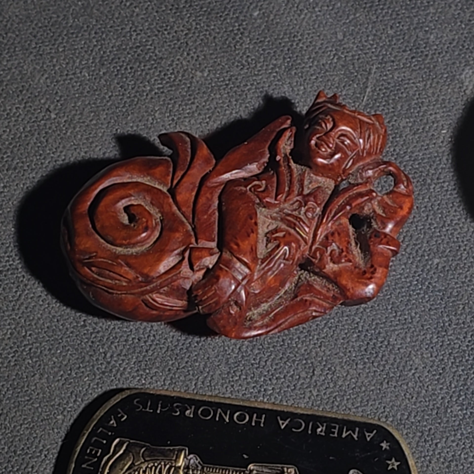 Grouping of Vintage and Modern Smalls including Carved Wood Figure, Carved Netsuke-Style Figure, U.S.M.C. Pin, United States Army Dog Tag Pendant, and Miniature Padlock